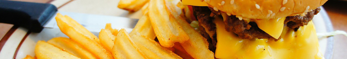 Eating Asian Fusion Burger at Kickin Burgers and Wings restaurant in Niles, IL.
